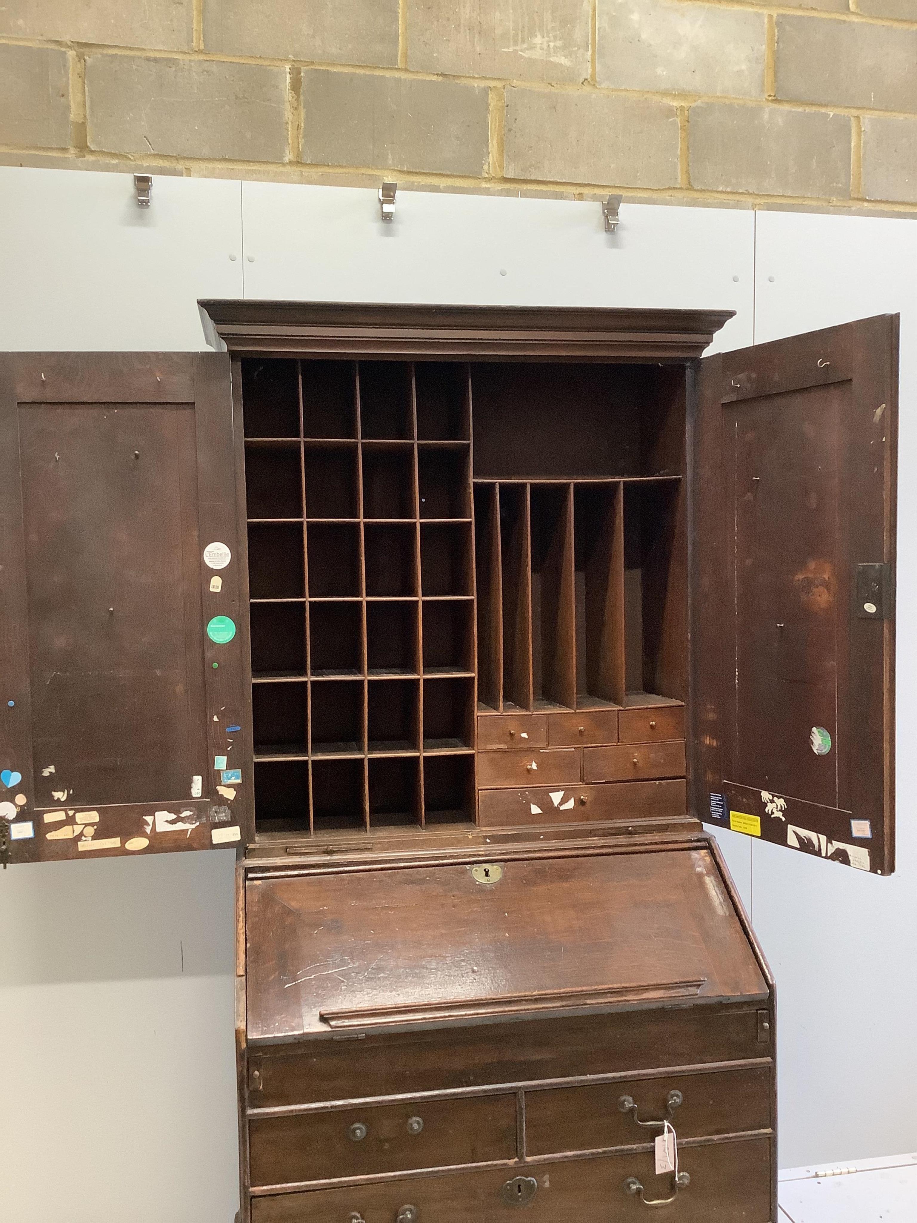 A George III oak bureau cabinet, width 96cm, depth 59cm, height 201cm